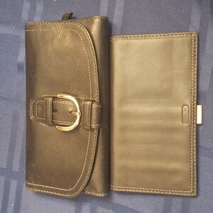 Coach black leather with pink interior with matching check book.